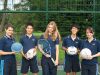 School students with sports equipment